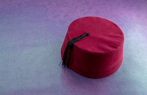 Traditional Turkish Hat Called Fez on leather background. High angle view.