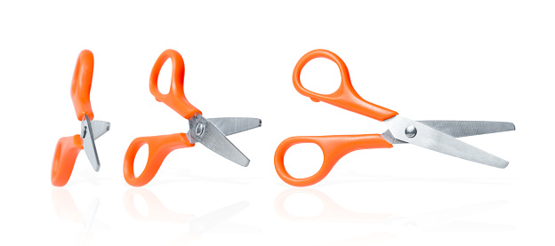 Stationery scissors collection. Three isolated scissors with orange handle on white background. School or office cutters with rings handles. Kids creativity safe tool.