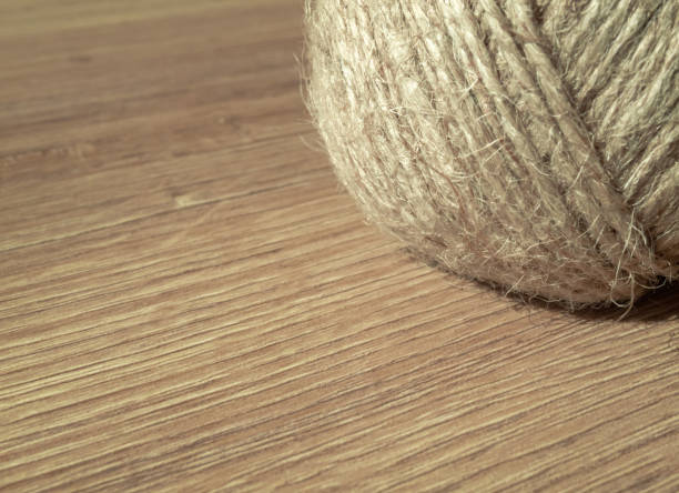 Jute rope texture on wooden ground. Craft handmade raw.