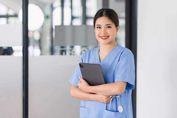 istock Confident Nurse with Digital Tablet in Hospital. 2077722441
