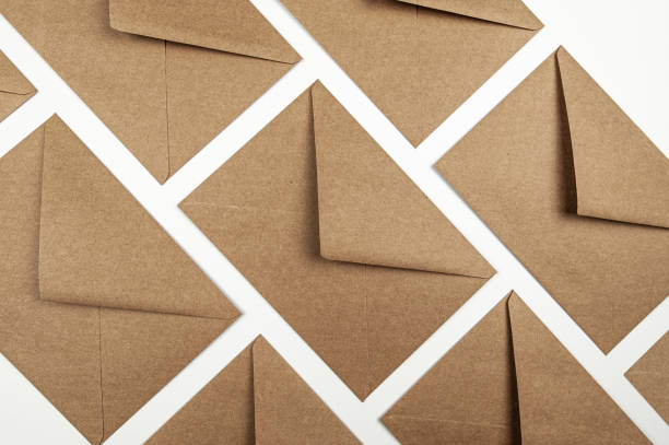 istock Top view of kraft paper envelopes on white background. 2077732453