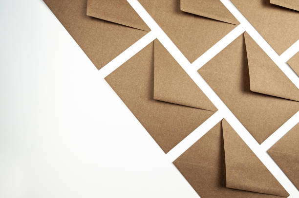 istock Top view of kraft paper envelopes on white background. 2077741539