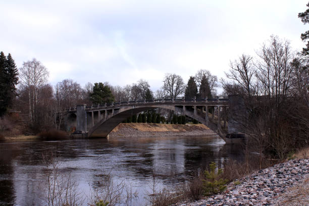 istock An old concrete bridge over a stream 2077744703