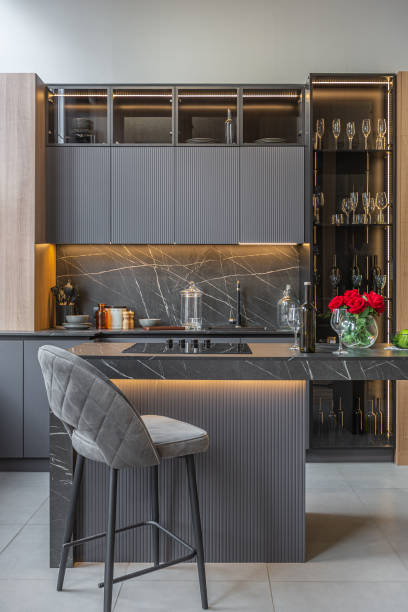 istock wood decorated dark kitchen area with coocking island in huge modern spacious apartment with high loft style ceilings, wooden decoration and grey walls 2077771821