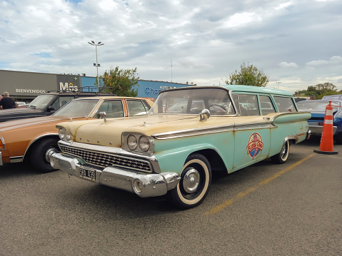 Buenos Aires, Argentina - Feb 25, 2024: Old aqua 1959 Ford Courier Country sedan station wagon at a classic car show in a parking lot, with Bubba Gump Shrimp Co logo on the door. Copy space