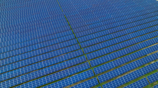istock AERIAL: Huge array of lined up solar panels as a part of photovoltaic system 2077785451