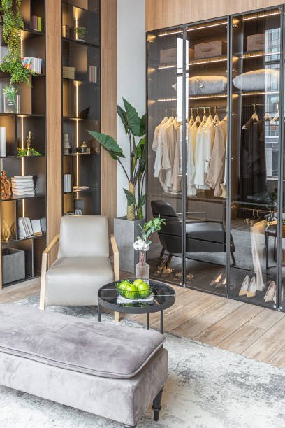 istock stylish dressing room with led lights in huge modern spacious apartment with high loft style ceilings, wooden decoration and grey walls 2077792909