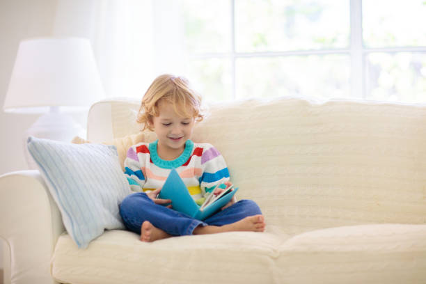 istock Child reading book. Kids read books. 2077807936