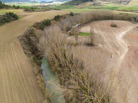Meander of the river between crop fields. Erro River, Navarra.