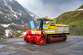 Snow cutter-blower machine parked along the Timmelsjoch high mountain pass