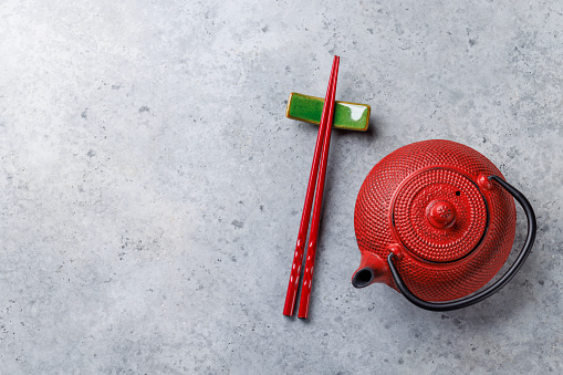 Japanese Table Setting with Teapot, Chopsticks, and Copy Space, Flat Lay