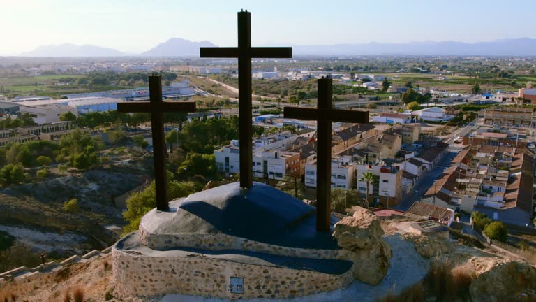 Monte Calvario and three crosses against townscape