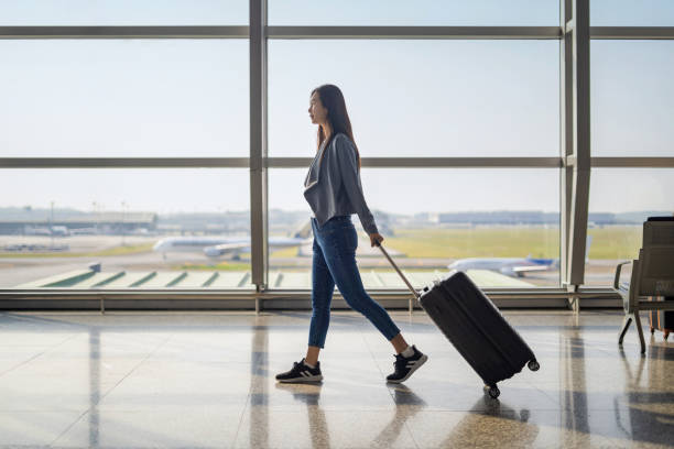 Woman walking to boarding gate for next flight