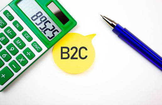 B2C Business to consumer,text,writing on a sheet with a calculator. B2C financial business concept.