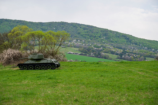 Green meadows, spring trees and Russian tanks.