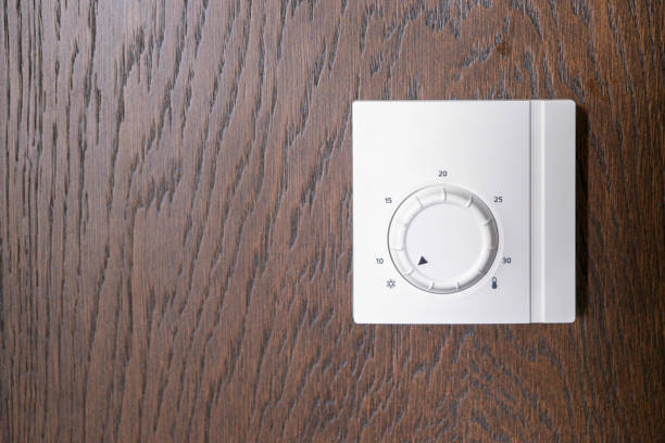 The air conditioning and heating control panel for the apartment and office is located on a wooden wall. Smart home device