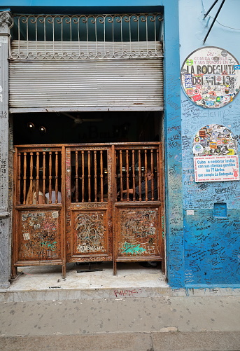 Havana, Cuba-October 7, 2019: La Bodeguita del Medio is a bar restaurant that was frequented by Ernest Hemingway where many passing visitors have left their mark -souvenirs, photos, objects, graffiti-