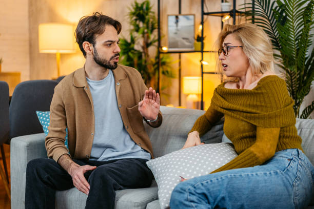 istock Young Couple Arguing On The Sofa At Home 2077953215