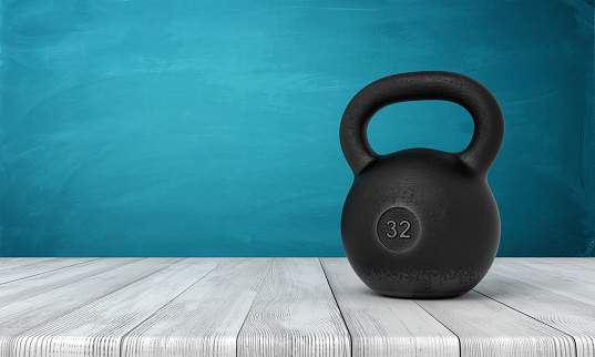 3d rendering of five 32 kg kettlebell on white wooden floor and dark turquoise background. Fitness and workout. Outdoor activities. Sporting goods.