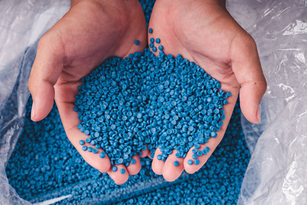 istock White plastic grain, plastic polymer granules,hand hold Polymer pellets, Raw materials for making water pipes, Plastics from petrochemicals and compound extrusion, resin from plant polyethylene. 2077957432
