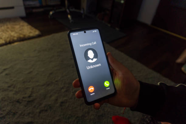 istock Woman holding mobile phone with incoming call from unknown caller 2077980300