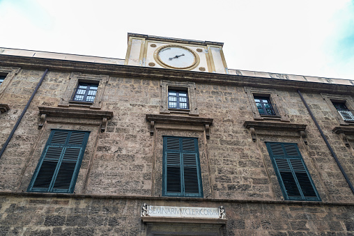 Palermo, Italy - May 13, 2023: Facade of the Seminarium Clericorum in the old town of Palermo, Sicily, Italy