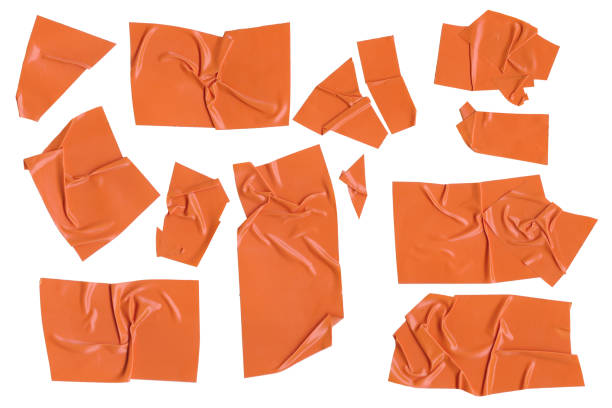istock Orange adhesive plastic tape pieces on white background. Orange isolation scotch tape. Masking paper tape torn and wrinkled pieces set 2078029526