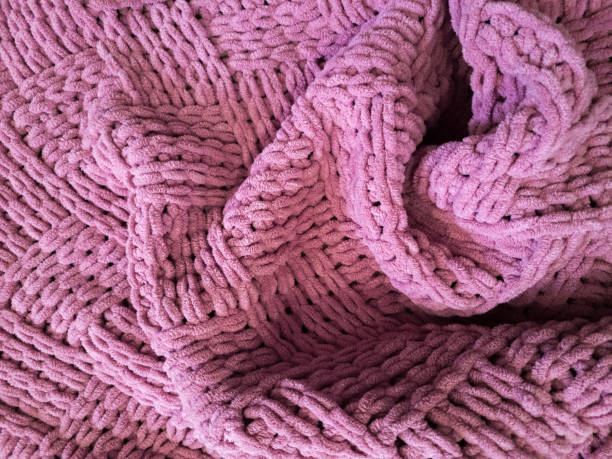istock The pink knitted texture with folds 2078038469