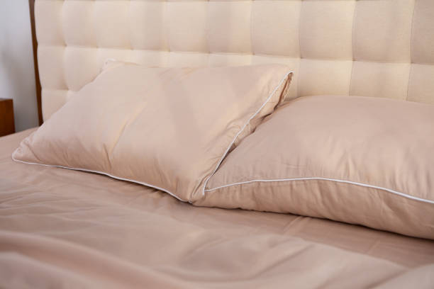 istock light beige satin bed linen and pillows 2078055368