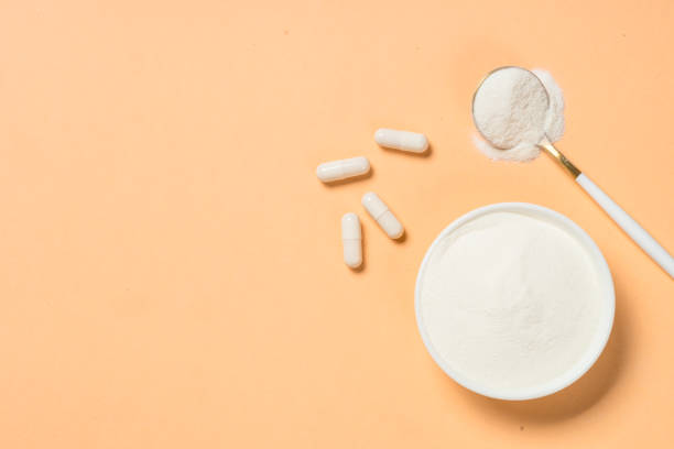istock Collagen powder dietary supplement at blue. 2078063799