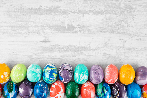 Easter eggs on white rustic background