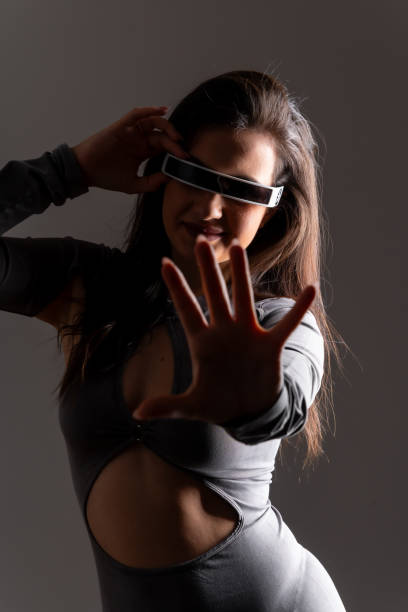 woman playing and gesturing using virtual reality mixed goggles - mr tom imagens e fotografias de stock