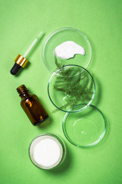 istock Cosmetic laboratory concept at green background top view. 2078118521