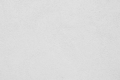Seamless white painted concrete wall texture - background