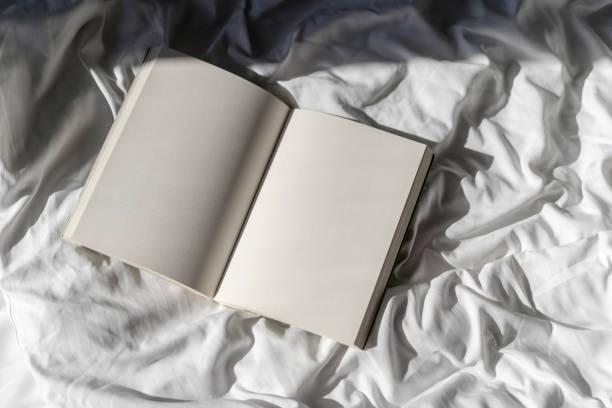 A Young College Student Studying For An Exam, Couldn't Take It Any More And Decided To Get Some Well Deserved Shut-eye, With A Book Covering His Face