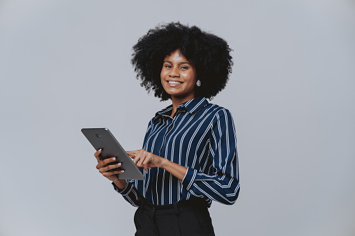 Portrait of a young businesswoman using tablet