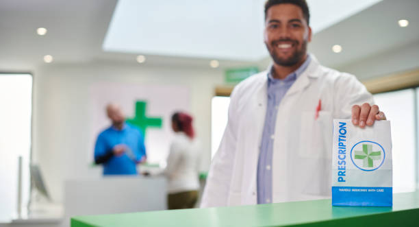 happy pharmacist with prescription bag