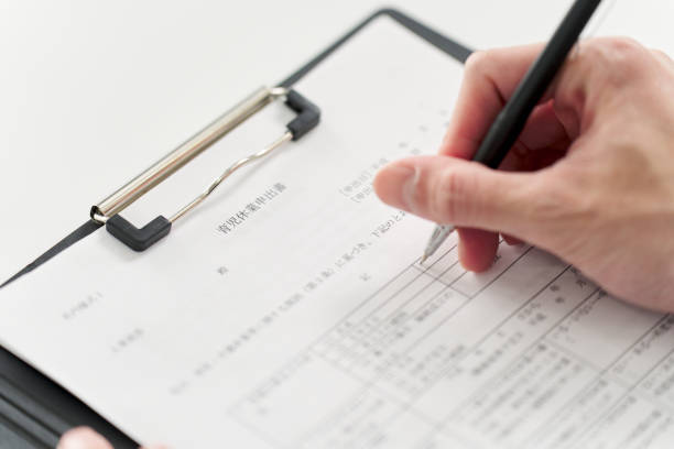 istock Businessman filling out parental leave application form 2078182211