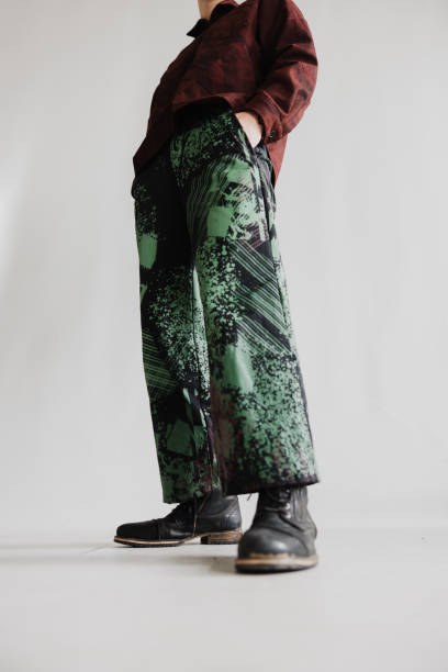 istock Cool Boy Stands Sideways With His Hands In His Pockets Wearing Baggy Clothes 2078193306