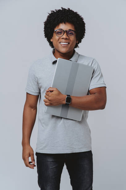 istock Portrait of a man holding laptop 2078225821
