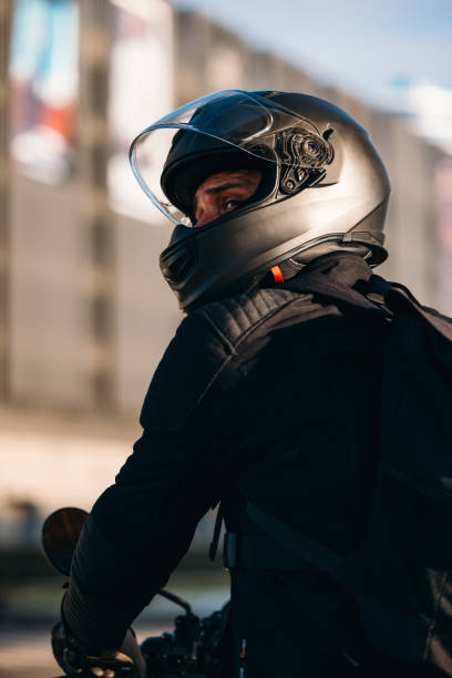 istock Anonymous Motorcycle Rider Looking over His Shoulder 2078245315