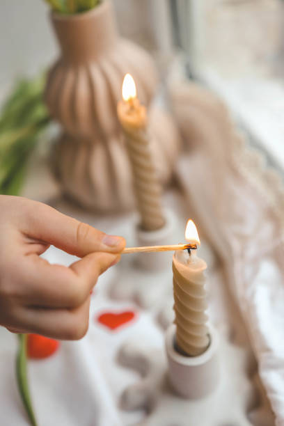 istock Girl lights a candle, spring aesthetics 2078248683
