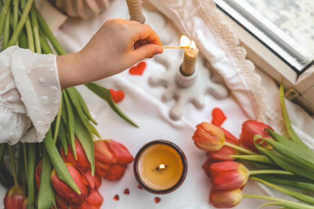 istock Girl lights a candle, spring aesthetics 2078249238