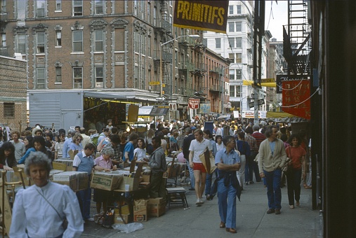 New York City, NY, USA, 1977. Street festival and flea market with vendors and visitors on Thomson Street in the Greenwich Village district.