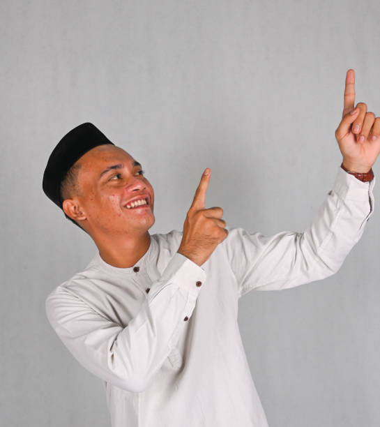 istock Asian young man excited and pointing up 2078264644