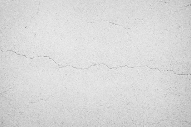 Concrete or stone texture for background in black, grey and white colors. Cement and sand wall of tone vintage grunge outdoor polished concrete texture. Building rough pattern floor decorating empty.