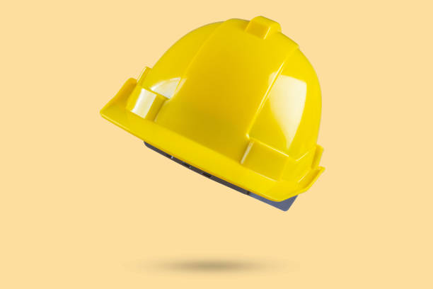 istock Safety construction helmet on yellow background 2078277035