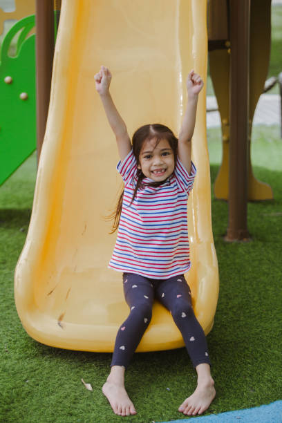 istock Happy  asian chlidren playing at the park at daytime. 2078281059