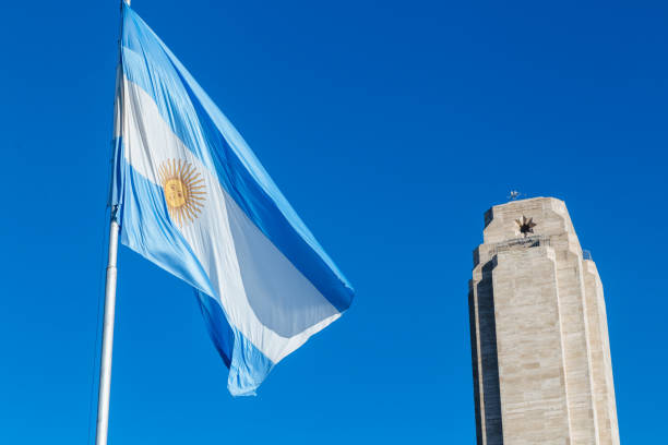Rosario city in Argentina. Monument to la Bandera. Rosario, Santa Fe, Argentina - June 28, 2023: The Argentine flag blowing in the wind inf front of a National Flag Monument in Rosario city, Argentina. light blue silk stock pictures, royalty-free photos & images