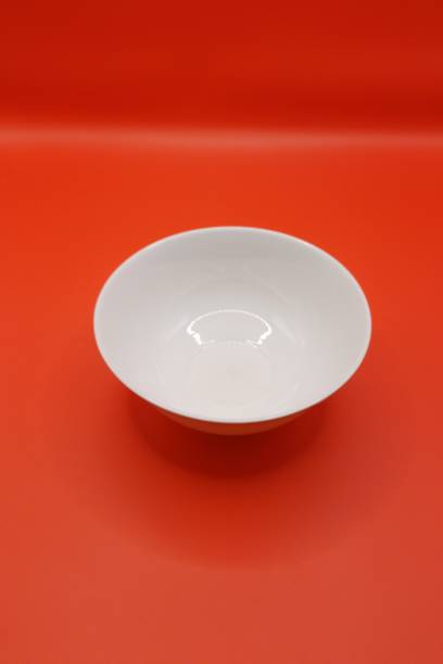 istock Top view of a bowl in red background. 2078304736